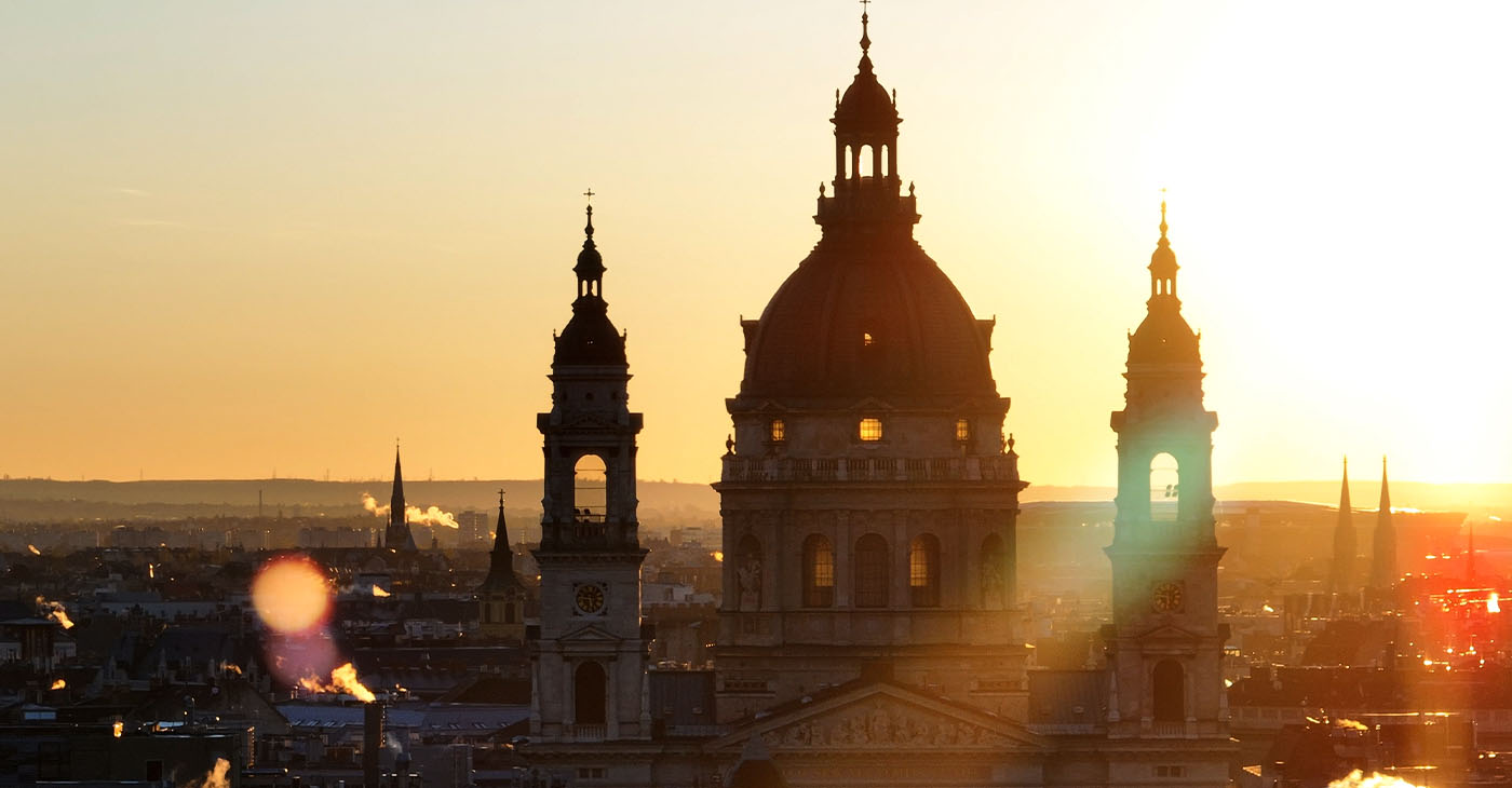 Aerial view of the famous St. Stephen's Basilica in Budapest at sunrise St. Stephen's Basilica is a Roman Catholic basilica in Budapest, Hungary. It is named in honour of Stephen, the first King of Hungary, whose right hand is housed in the reliquary. Since the renaming of the primatial see, it has been the co-cathedral of the Roman Catholic Archdiocese of Esztergom-Budapest. Today, it is the third largest church building in present-day Hungary. It is the largest church in Budapest and a World Heritage Site. (Photo by Guven Ozdemir)
