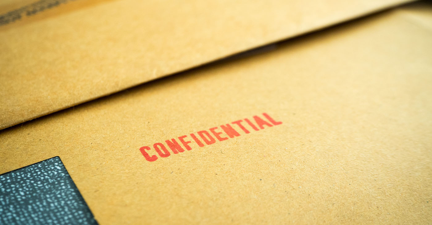 "Confidential" printed on brown vintage envelope, in macro