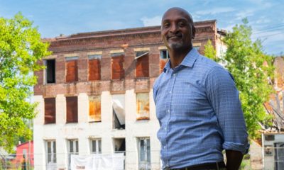 Phillip Howard of the Conversation standing in front of the Edistone Hotel in Selma Alabama. (Attribution, The Conservation Fund.)
