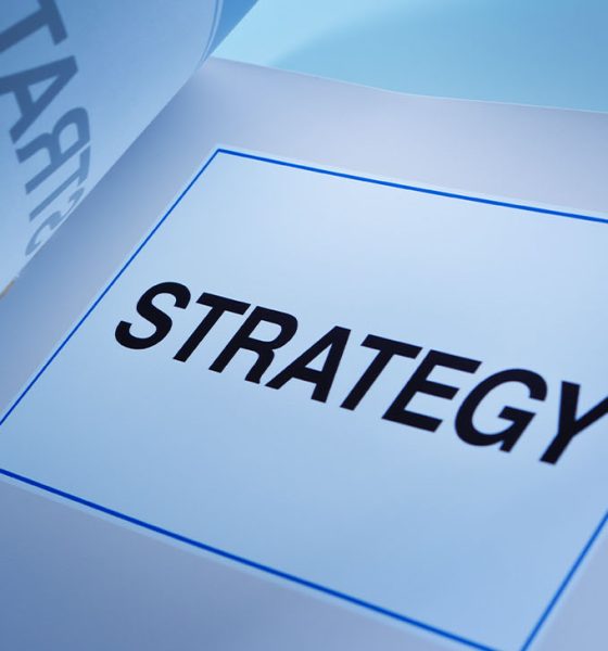 A still life of a working business plan book. A fundamental document that guide a business venture, its strategy, positioning, market, administration, management and all aspect of any business.