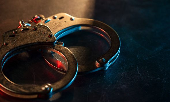 Handcuffs on dark background