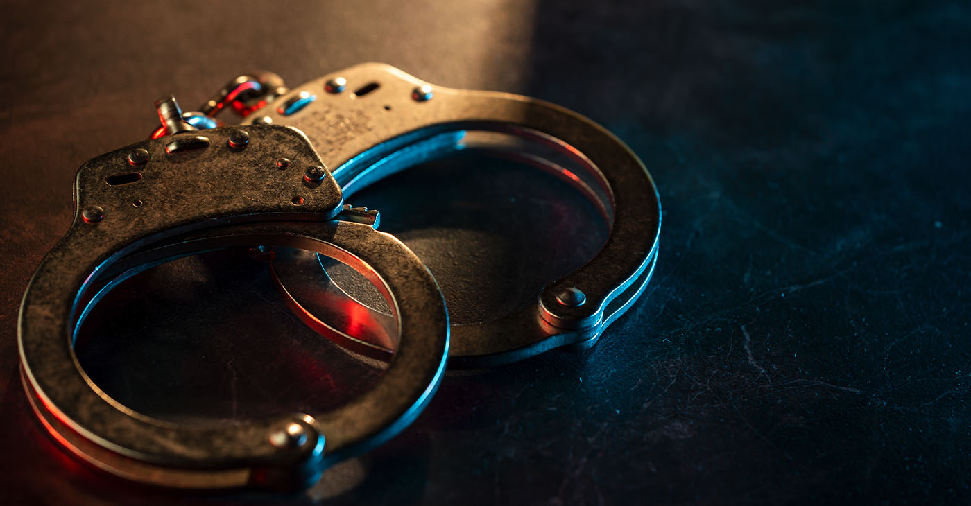 Handcuffs on dark background