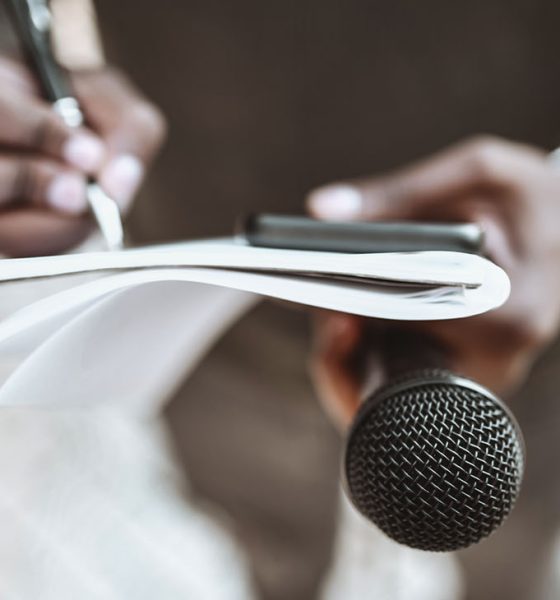 Male Journalist Preparing Questions For Press Conference (Photo by Aleksandar Georgie)