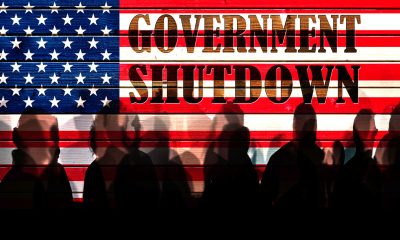 Lot of people shadows against USA flagged fence, shutdown concept