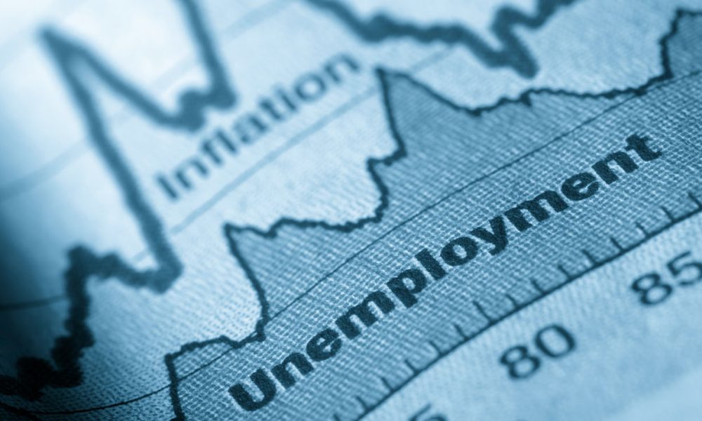Business graph unemployment and inflation in newspapers