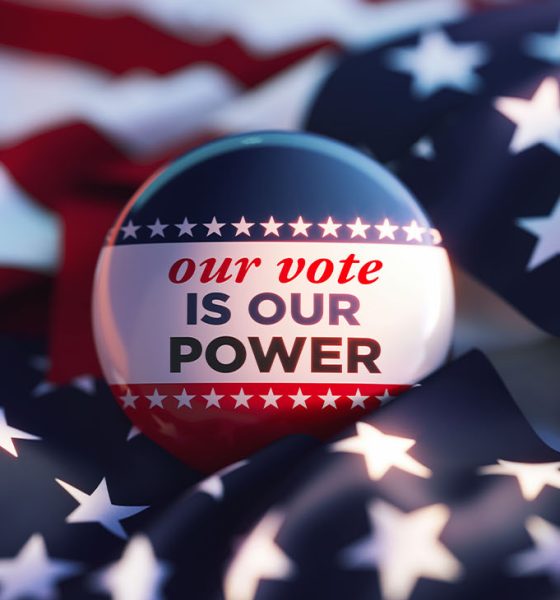 Our Vote Is Our Power printed badge over American flag. Horizontal composition. Election concept.