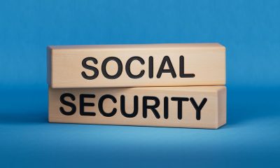 Time to social security symbol. Concept words Social security on wooden blocks. Business and social security concept. Copy space.3D rendering on blue background. (Photo by Bo Feng)