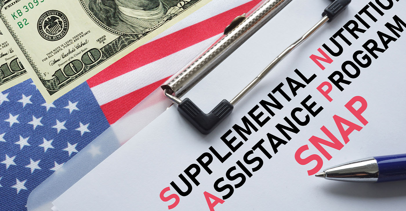 SNAP Supplemental Nutrition Assistance Program is shown using the text. SNAP provides food benefits to low-income families in US (Photo by Andrii Dodonov)