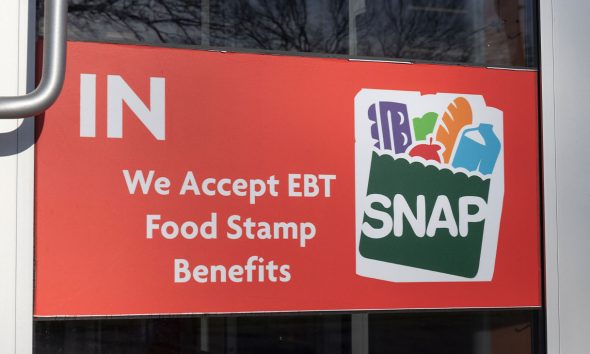 Chicago - Circa April 2022: SNAP and EBT Accepted here sign. SNAP and Food Stamps provide nutrition benefits to supplement the budgets of disadvantaged families.