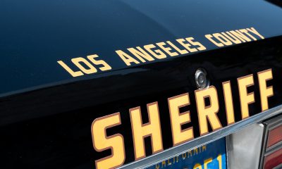 Los Angeles police officers get ready to respond to a call. Despite offering $50,000 rewards, the police department has a difficult time solving most hit-and-run cases, according to columnist Earl Ofari Hutchinson. Photo: iStockphoto / NNPA.