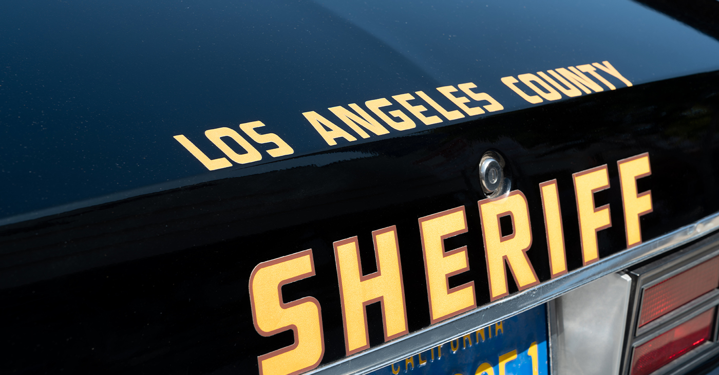Los Angeles police officers get ready to respond to a call. Despite offering $50,000 rewards, the police department has a difficult time solving most hit-and-run cases, according to columnist Earl Ofari Hutchinson. Photo: iStockphoto / NNPA.