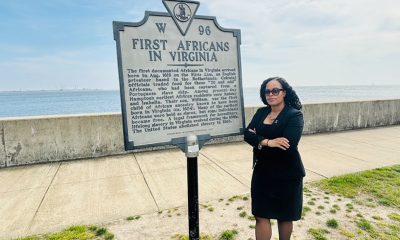 Thena Robinson Mock pictured next to the site recognizing the arrival of the first documented Africans in Virginia. Photo courtesy Thena Robinson Mock.