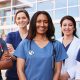 Female healthcare colleagues standing outside hospital