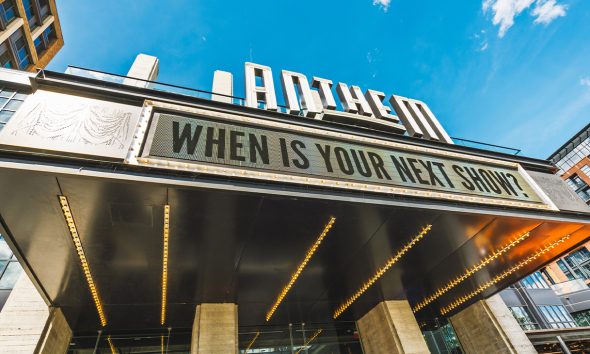 Anthem music venue's bold signage against a vibrant blue sky, inviting the next show in Washington, DC’s lively Wharf neighborhood. Photo: iStockphoto / NNPA.