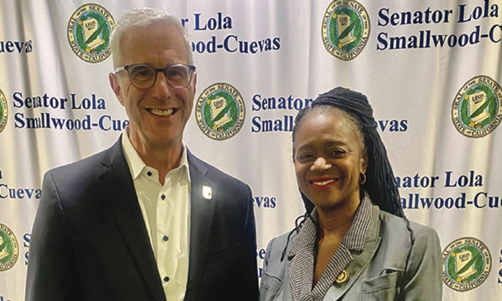 Reynold Hoover, LA28 Chief Executive Officer, is pictured with Senator Lola Smallwood-Cuevas at a Workforce & Procurement Symposium she hosted for South LA community stakeholders.