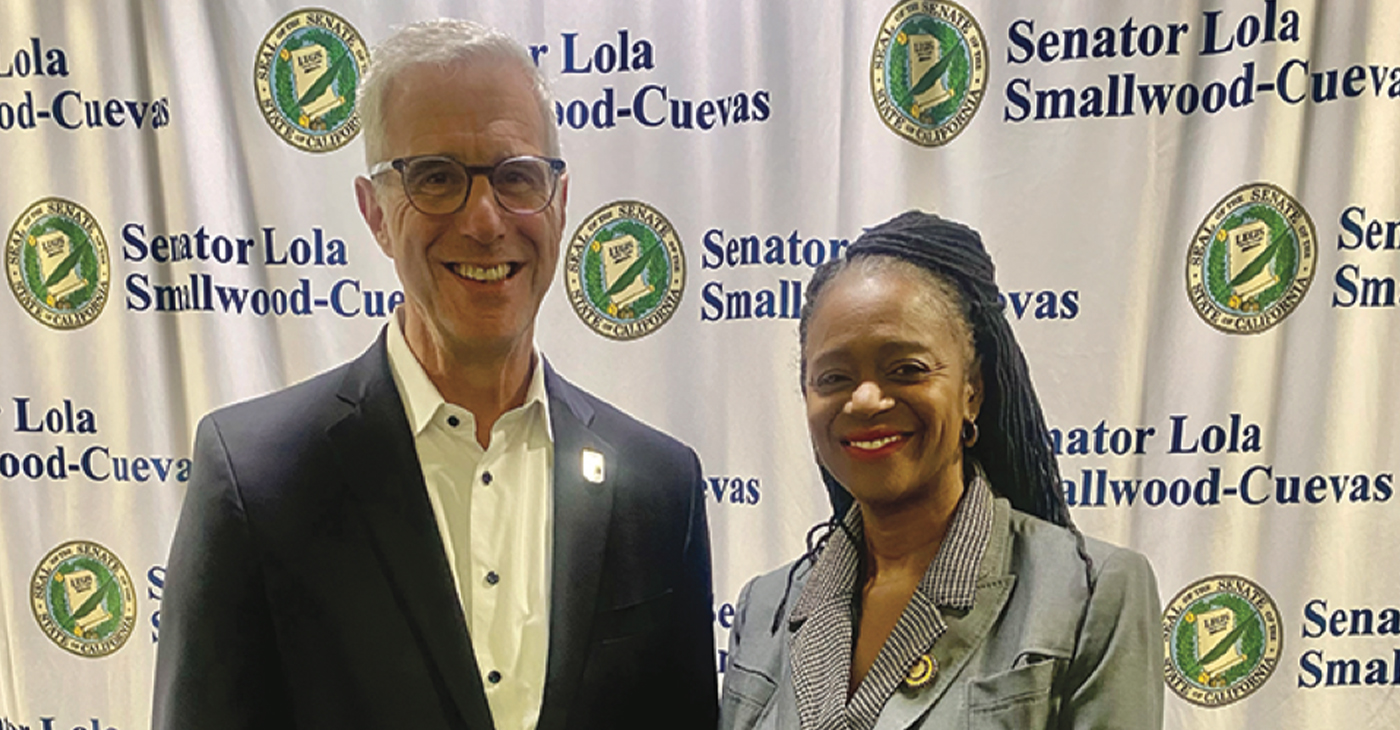 Reynold Hoover, LA28 Chief Executive Officer, is pictured with Senator Lola Smallwood-Cuevas at a Workforce & Procurement Symposium she hosted for South LA community stakeholders.