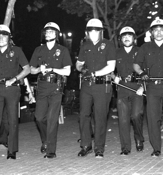Los Angeles, California - April 29, 1992: LAPD officers advance along Temple Street, downtown, during the first day of the Rodney King riots. Photo: iStockphoto / NNPA.