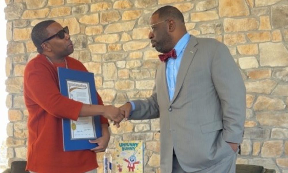 Thompson (left), with the Fulton County Proclamation, presented by Atlanta City Council member Marvin Arrington Jr.  Photo by Noah Washington/The Atlanta Voice