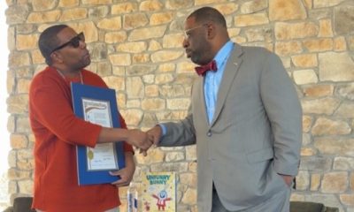Thompson (left), with the Fulton County Proclamation, presented by Atlanta City Council member Marvin Arrington Jr.  Photo by Noah Washington/The Atlanta Voice