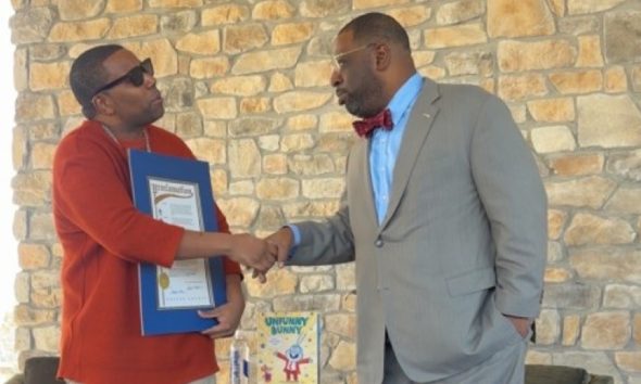 Thompson (left), with the Fulton County Proclamation, presented by Atlanta City Council member Marvin Arrington Jr.  Photo by Noah Washington/The Atlanta Voice