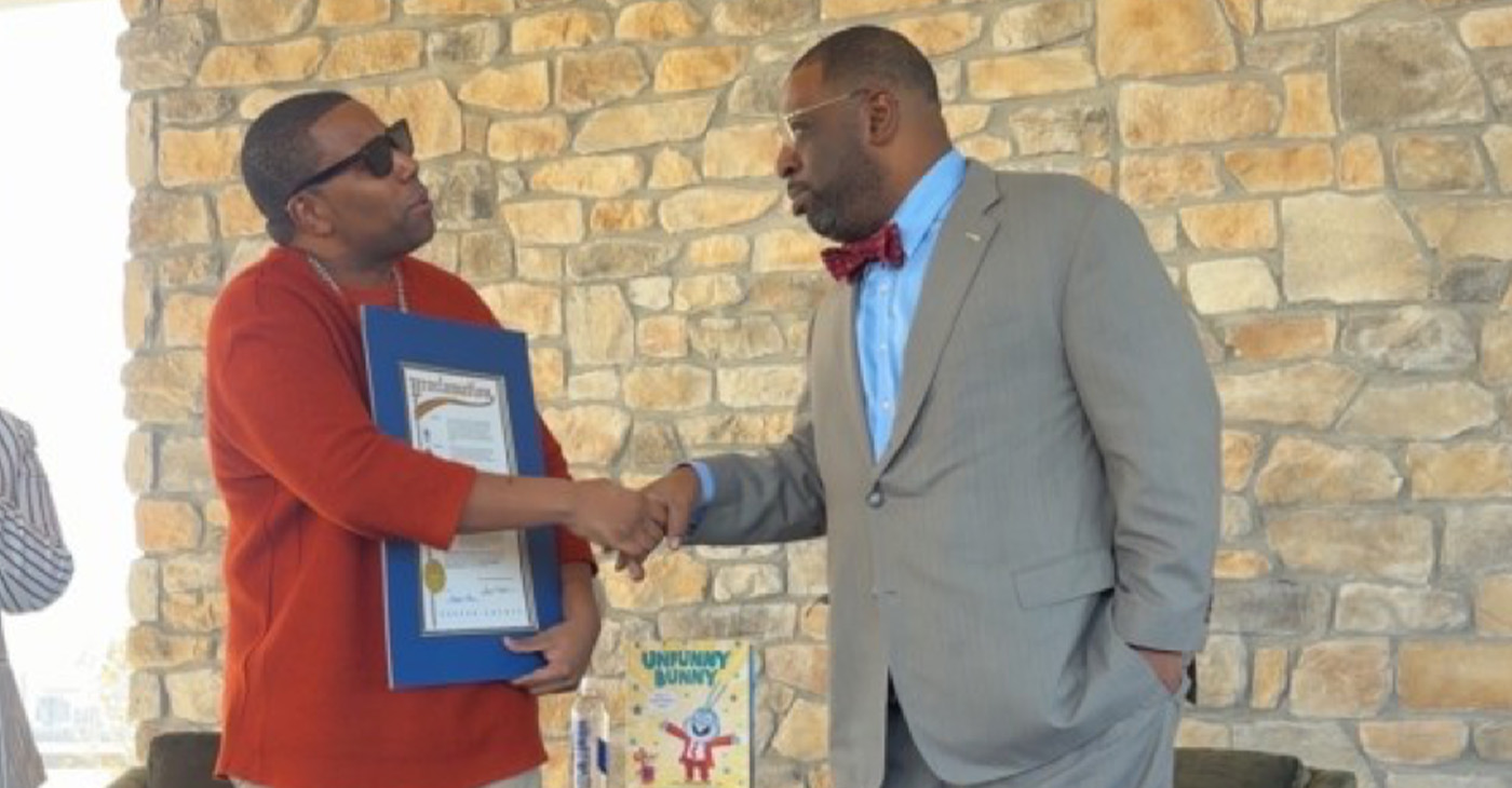 Thompson (left), with the Fulton County Proclamation, presented by Atlanta City Council member Marvin Arrington Jr.  Photo by Noah Washington/The Atlanta Voice