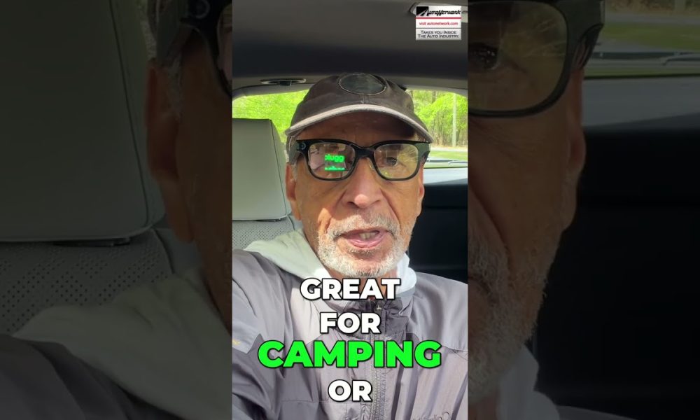 Man wearing a cap and glasses sits in a car; on-screen text reads 'GREAT FOR CAMPING OR'