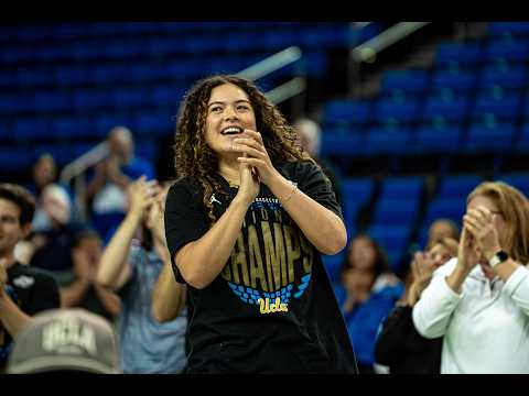 UCLA women's basketball team celebrating their national championship win, hoisting the trophy