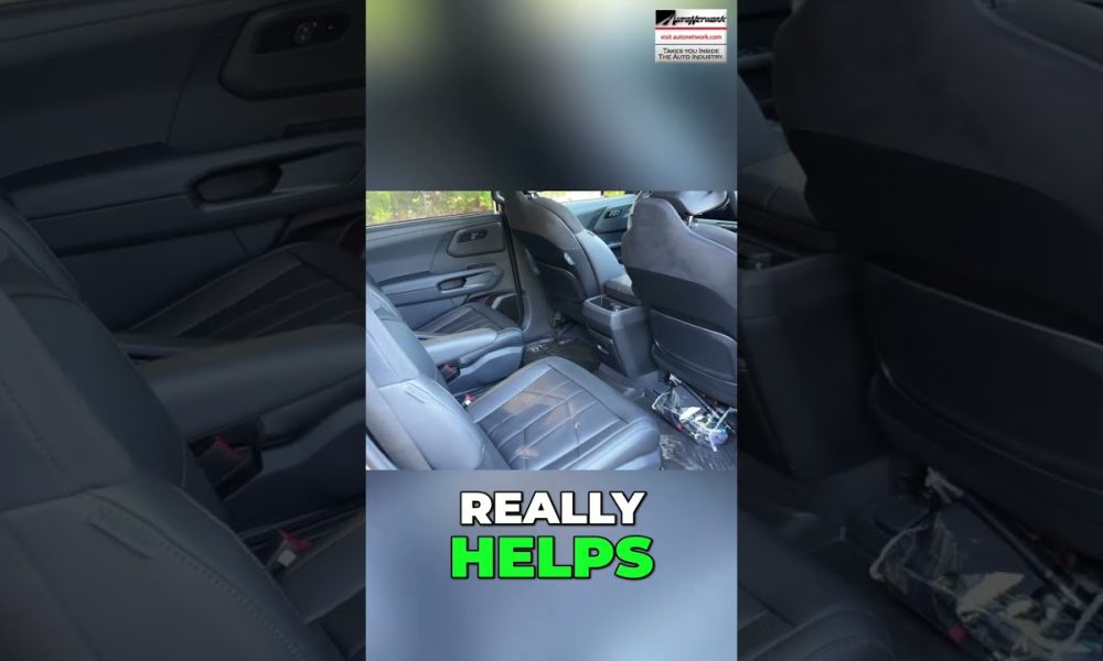 Back seat interior of a dark car with black leather seats; clutter on the floor and a small logo in the top-right, overlaid text reads 'REALLY HELPS'.