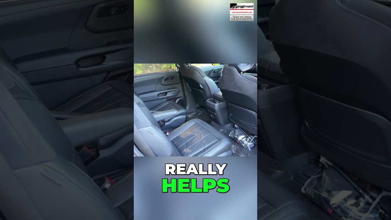 Back seat interior of a dark car with black leather seats; clutter on the floor and a small logo in the top-right, overlaid text reads 'REALLY HELPS'.