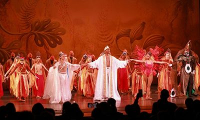 A performer from the Dance Theatre of Harlem is captured mid-dance, showcasing the elegance and athleticism of ballet. Photo courtesy New York Carib News.