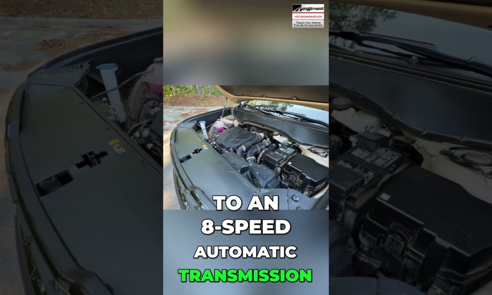 Open-hood car engine bay with a bold text overlay about an 8-speed automatic transmission.