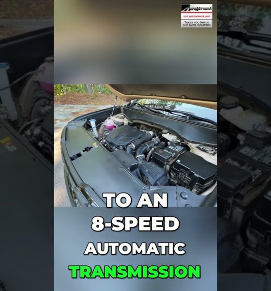Open-hood car engine bay with a bold text overlay about an 8-speed automatic transmission.
