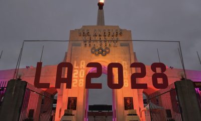 An LA2028 sign in front of a blazing Olympic cauldron at the Los Angeles Memorial Coliseum on Wednesday, Sept. 13, 2017. The cauldron was lit early Wednesday morning at the stadium that was the site of the 1932 and 1984 Olympics. (AP Photo/Richard Vogel)