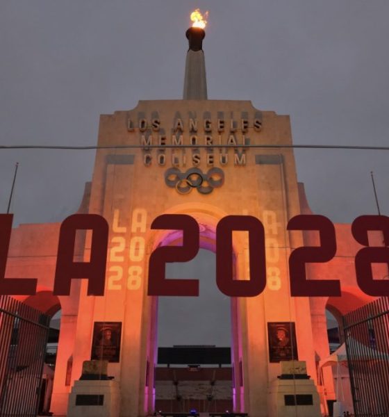 An LA2028 sign in front of a blazing Olympic cauldron at the Los Angeles Memorial Coliseum on Wednesday, Sept. 13, 2017. The cauldron was lit early Wednesday morning at the stadium that was the site of the 1932 and 1984 Olympics. (AP Photo/Richard Vogel)