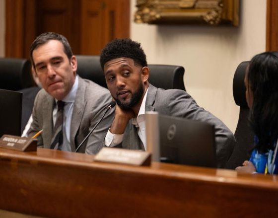 The Baltimore City Board of Estimates held its annual Taxpayers’ Night on April 22 at Baltimore City Hall. During the hearing, members of the board, including City Council President Zeke Cohen (left), Mayor Brandon M. Scott and City Solicitor Ebony Thompson, listened to residents’ feedback on the preliminary budget for fiscal year 2027. Credit: Photo by J.J. McQueen