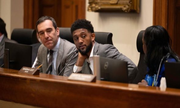 The Baltimore City Board of Estimates held its annual Taxpayers’ Night on April 22 at Baltimore City Hall. During the hearing, members of the board, including City Council President Zeke Cohen (left), Mayor Brandon M. Scott and City Solicitor Ebony Thompson, listened to residents’ feedback on the preliminary budget for fiscal year 2027. Credit: Photo by J.J. McQueen