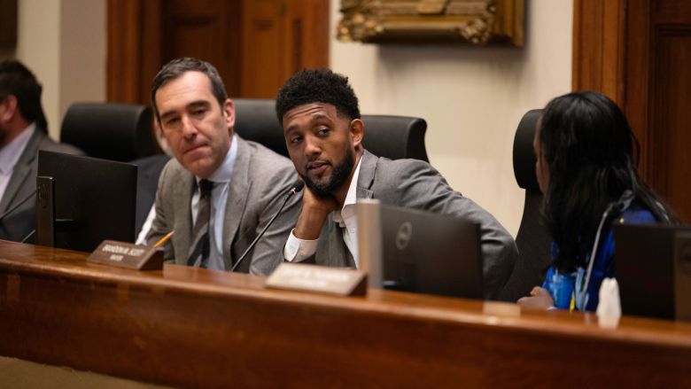 The Baltimore City Board of Estimates held its annual Taxpayers’ Night on April 22 at Baltimore City Hall. During the hearing, members of the board, including City Council President Zeke Cohen (left), Mayor Brandon M. Scott and City Solicitor Ebony Thompson, listened to residents’ feedback on the preliminary budget for fiscal year 2027. Credit: Photo by J.J. McQueen
