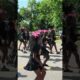 Wichita Juneteenth Parade 2026: Performers march down parade route keeping in step.