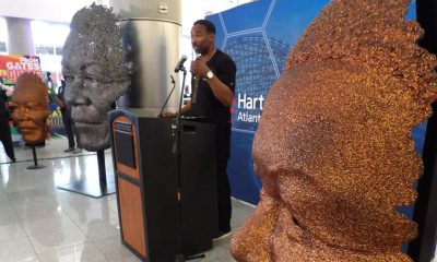 Mayor Andre Dickens addresses guests attending the unveiling of the Nelson Mandela sculpture at the Maynard Jackson International arrivals lobby. (Stan Washington)