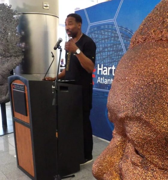 Mayor Andre Dickens addresses guests attending the unveiling of the Nelson Mandela sculpture at the Maynard Jackson International arrivals lobby. (Stan Washington)
