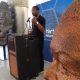 Mayor Andre Dickens addresses guests attending the unveiling of the Nelson Mandela sculpture at the Maynard Jackson International arrivals lobby. (Stan Washington)