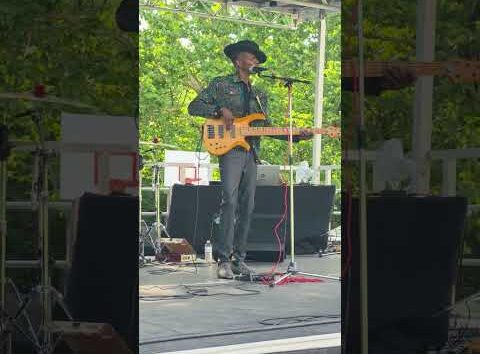 Juneteenth celebration in Topeka, Kansas featuring a T-Town band performing live music outdoors.