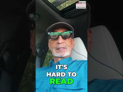 Car dashboard glare and small fonts create readability issues, a common problem for drivers.
