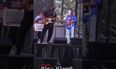 Jubu Smith performing guitar on stage at Juneteenth ICT, Kansas