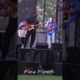 Jubu Smith performing guitar on stage at Juneteenth ICT, Kansas