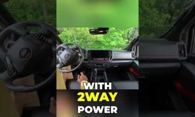 Nissan Frontier interior with 12.3" touchscreen, Apple CarPlay, and heated seats.