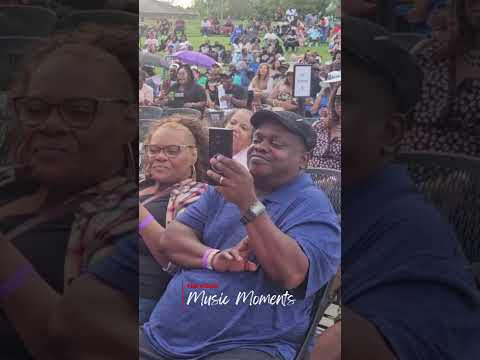 Fans join Rome on stage at a concert, captured by The Community Voice (KS)