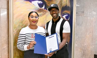 DeMarcus Suggs, director of Creative and Cultural Economy for the City of Memphis, presents a proclamation to Memphis-born filmmaker Julia Griggs.