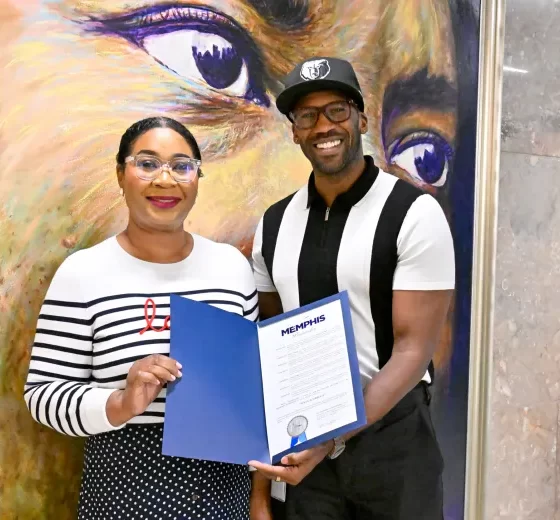 DeMarcus Suggs, director of Creative and Cultural Economy for the City of Memphis, presents a proclamation to Memphis-born filmmaker Julia Griggs.