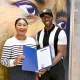 DeMarcus Suggs, director of Creative and Cultural Economy for the City of Memphis, presents a proclamation to Memphis-born filmmaker Julia Griggs.